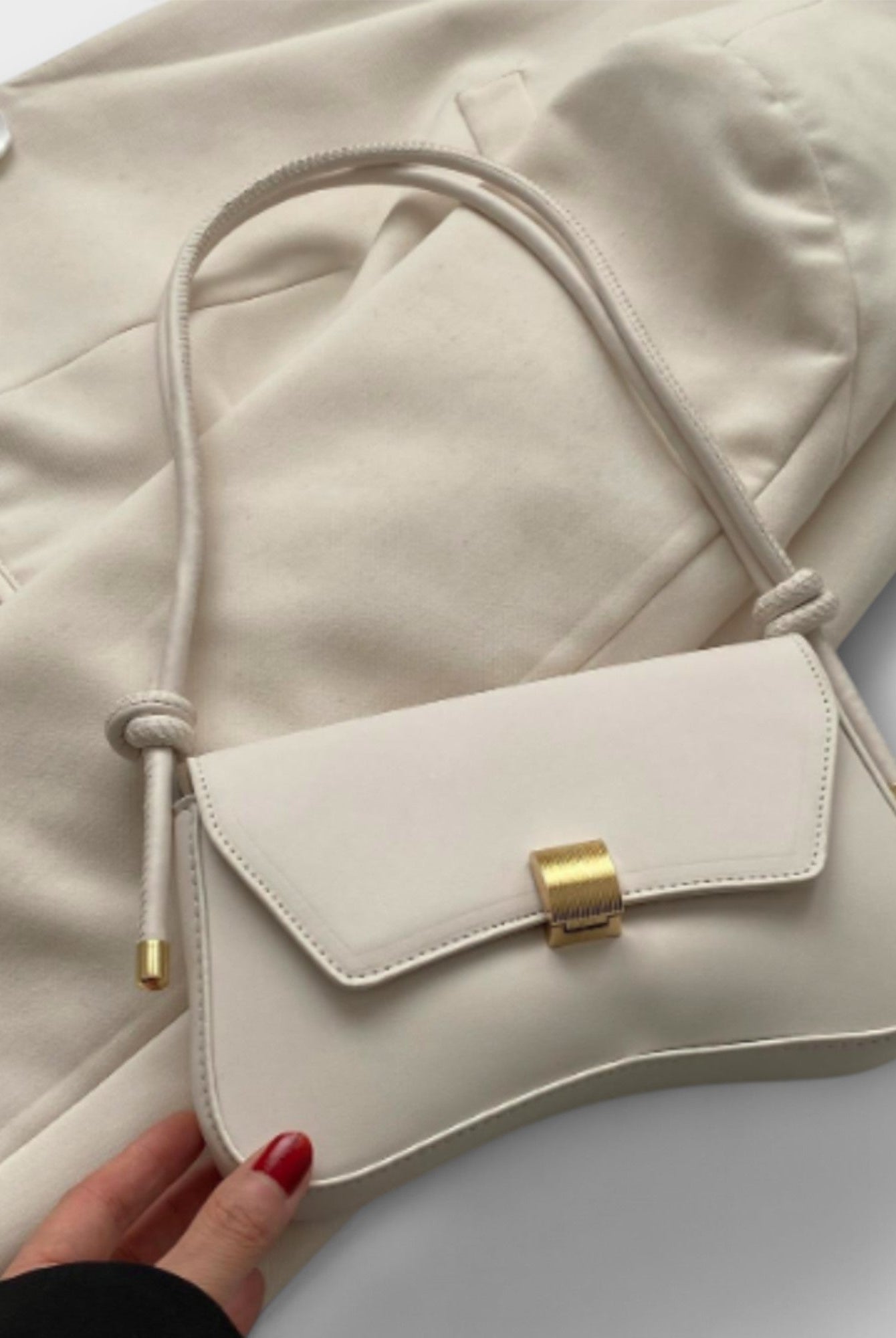 Lumina Wear Cécile mini shoulder bag in terracotta with a sleek design, featuring elegant craftsmanship and compact style.