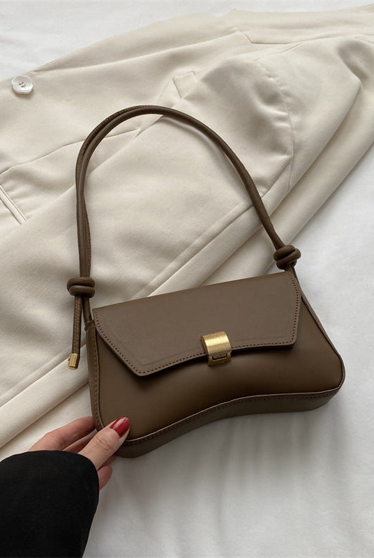 Lumina Wear Cécile mini shoulder bag in terracotta with sleek, elegant design, perfect for stylish everyday use.