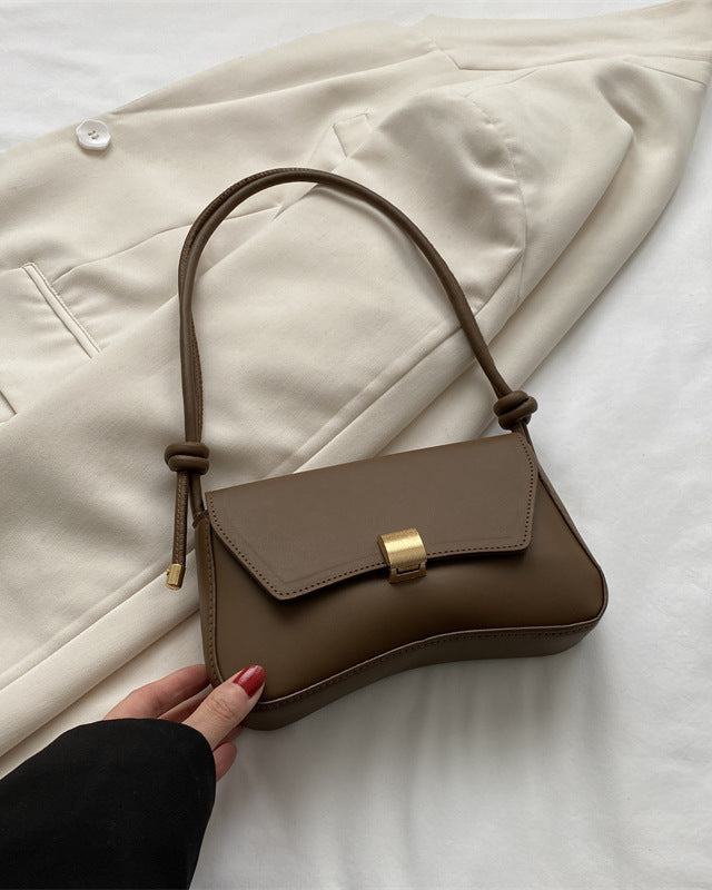 Terracotta Lumina Cécile mini shoulder handbag with sleek, elegant design and gold-tone hardware, perfect for stylish everyday use.