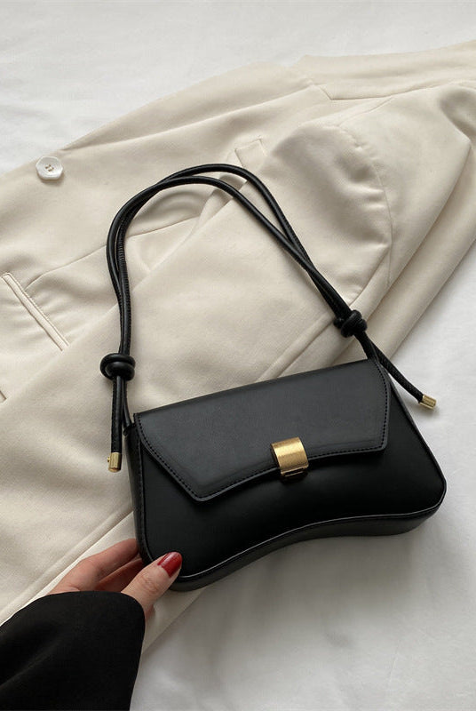 Lumina Wear Cécile mini shoulder bag in terracotta with a sleek, elegant design, perfect for stylish everyday use.