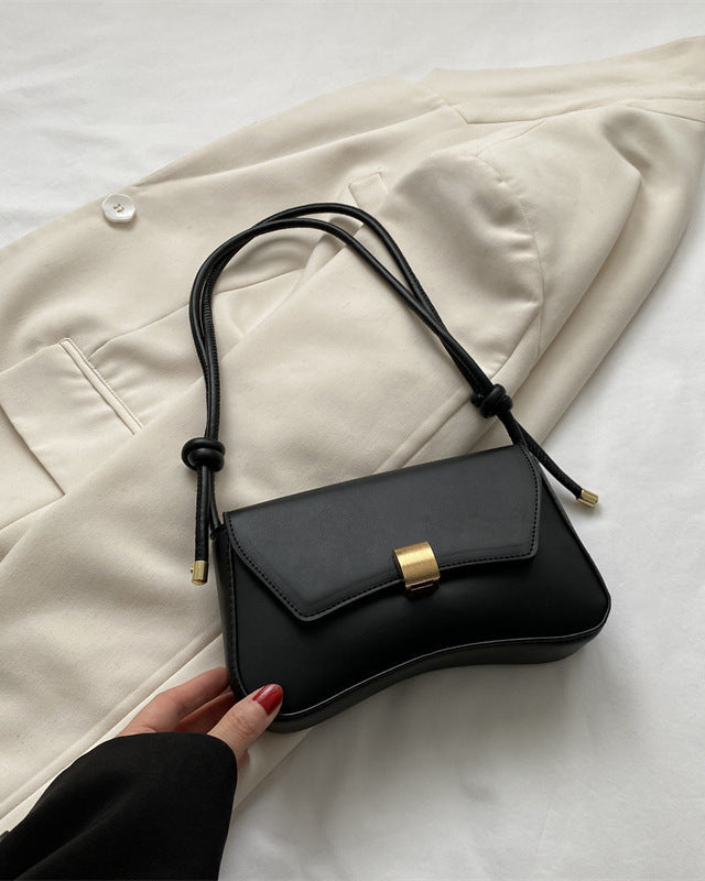 Lumina Wear Cécile sleek mini shoulder bag in terracotta with elegant design, featuring smooth leather and a compact silhouette.