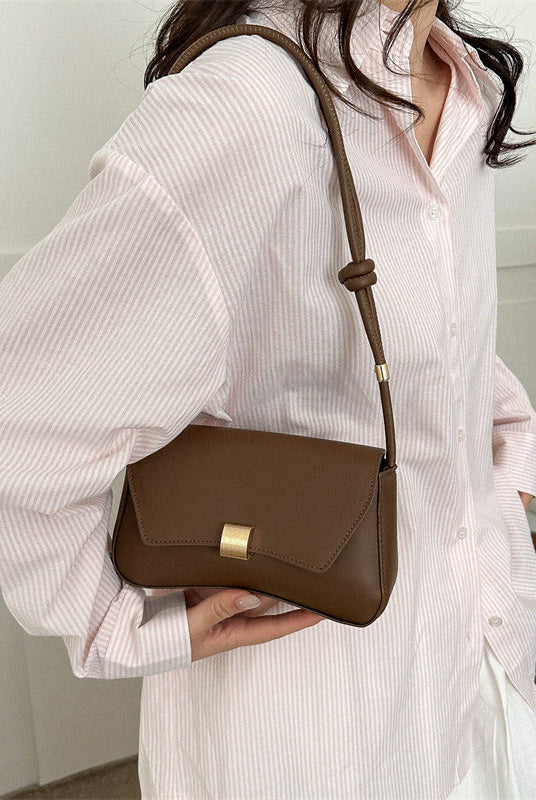 Lumina Wear Cécile sleek mini shoulder bag in terracotta with elegant design, featuring smooth leather and a compact silhouette.