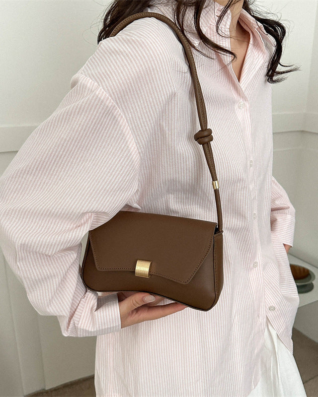Lumina Wear Cécile sleek mini shoulder bag in terracotta with elegant design, featuring smooth leather and stylish hardware.