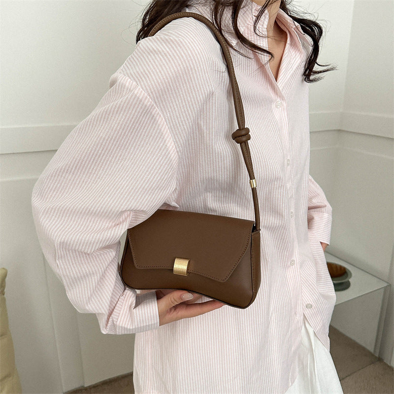 Lumina Wear Cécile sleek mini shoulder bag in terracotta with elegant design, featuring smooth leather and a compact silhouette.