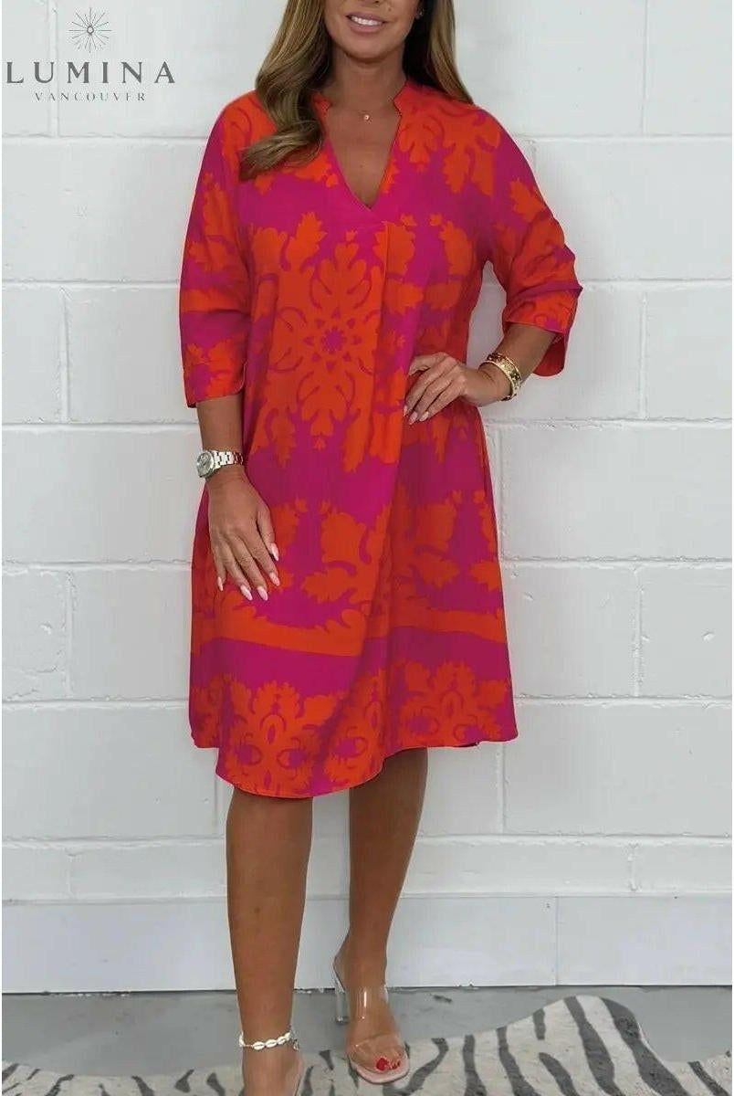 Blue and army green Bergljot spring dress by Lumina Wear, featuring a flowy silhouette and floral pattern.