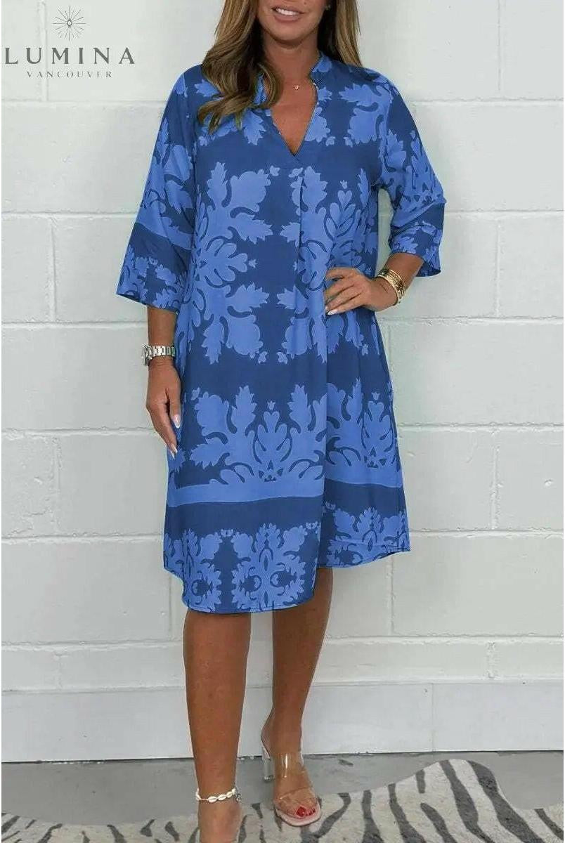 Blue and army green Bergljot spring dress by Lumina Wear, featuring a casual, flowy design with floral accents.