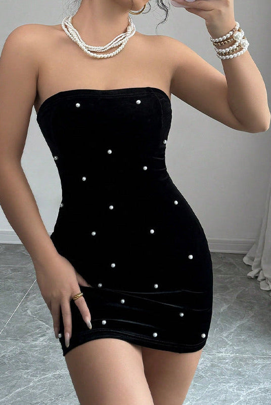 Black strapless velvet mini dress by Lumina Wear, showing a fitted silhouette and elegant design perfect for evening wear.
