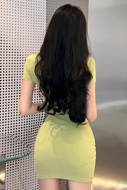 Green Celestoria slim fit mini dress by Lumina Vancouver, showcasing a stylish and fitted silhouette perfect for casual or evening wear.
