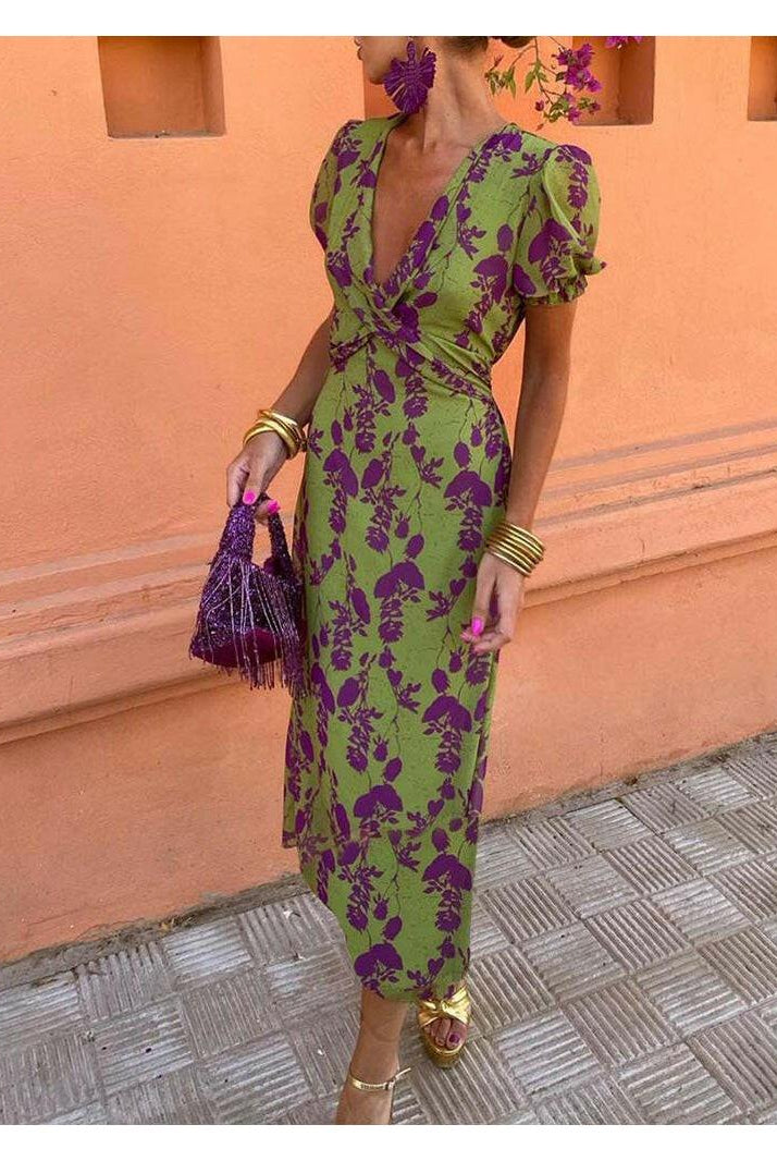 Elegant floral dress by Lumina Wear featuring a fitted bodice and flowy skirt, perfect for spring and summer occasions.