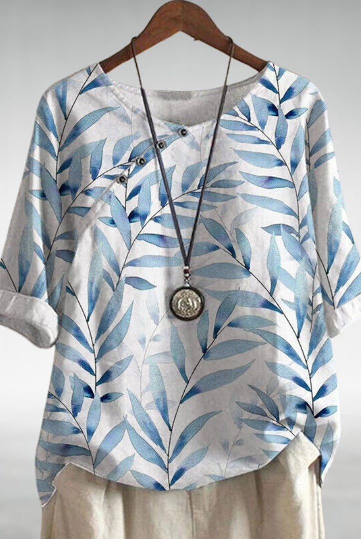 Blue Charlotte Breezy Leaf Print Blouse by Lumina Wear with button-up design, lightweight fabric, and casual style.