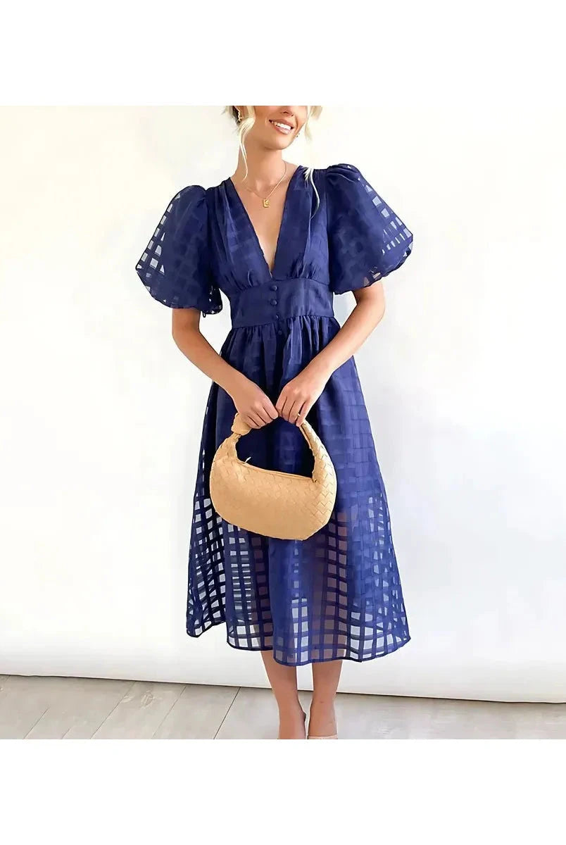 Pink Cindy midi dress by Lumina Vancouver featuring classic patterns and puff sleeves, perfect for stylish daytime wear.