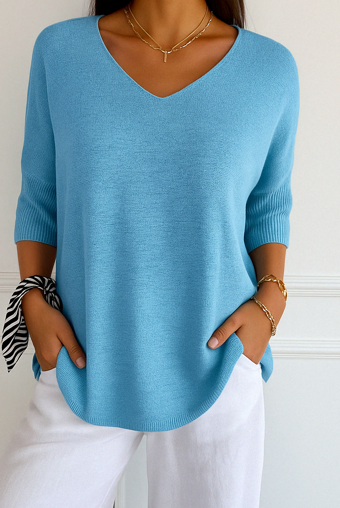 Dark gray Lumina Wear Clara relaxed V-neck women's sweater with minimalist design, soft knit fabric, and comfortable fit.