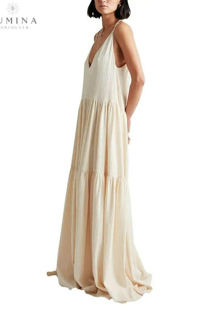 Lumina Wear Clarissa Ocean Breeze Maxi Dress in white, featuring a flowing design perfect for summer or holiday style.