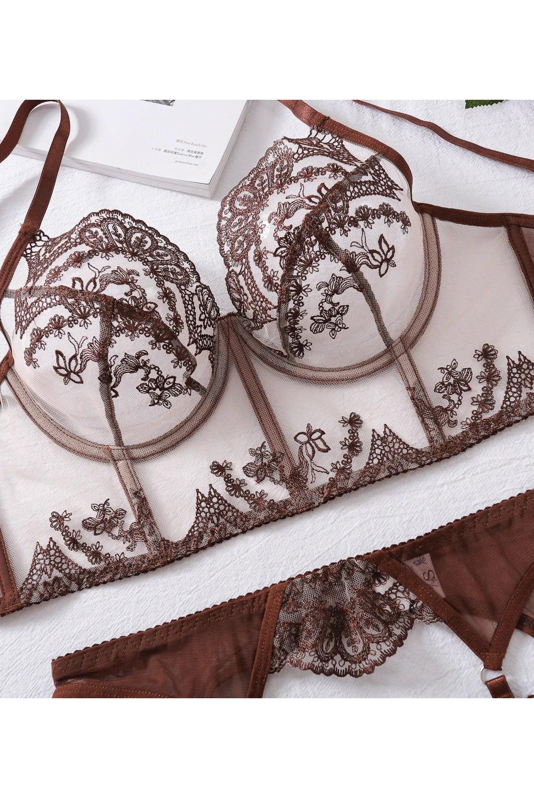 Cosette's lingerie set from Lumina Wear featuring a delicate lace bra and matching panties in soft pastel colors.