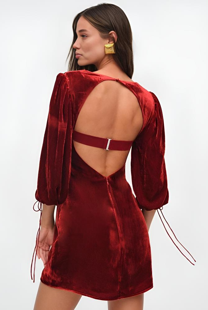 Maroon velvet mini dress with puff sleeves from Lumina Vancouver's Crimson Dawn collection, stylish and fitted for trendy occasions.