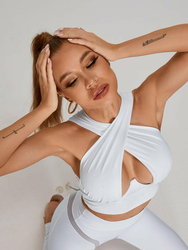 White Cross Super Lift Sports Bra by Lumina Vancouver featuring a supportive, stylish design for active wear.