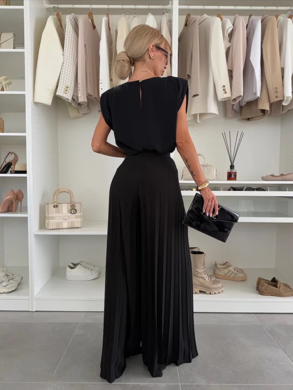 Black Daisy elegant pleated two-piece set by Lumina Wear, featuring a flattering fit and stylish clothing set design.