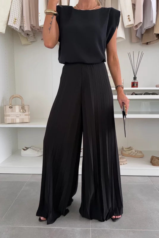 Elegant Daisy black pleated two-piece clothing set by Lumina Wear, featuring a flattering fit and stylish design.