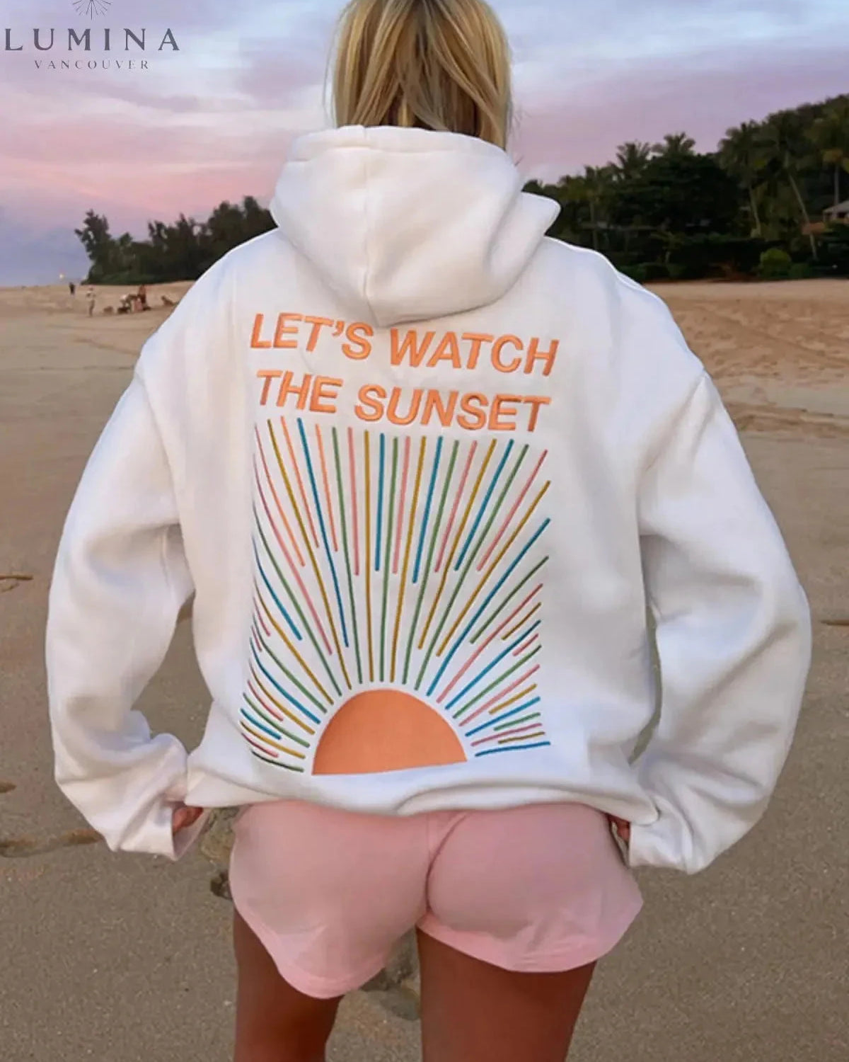 White Dalia Sunset Hoodie by Lumina Wear featuring a vibrant sunset design on soft fabric, size small.