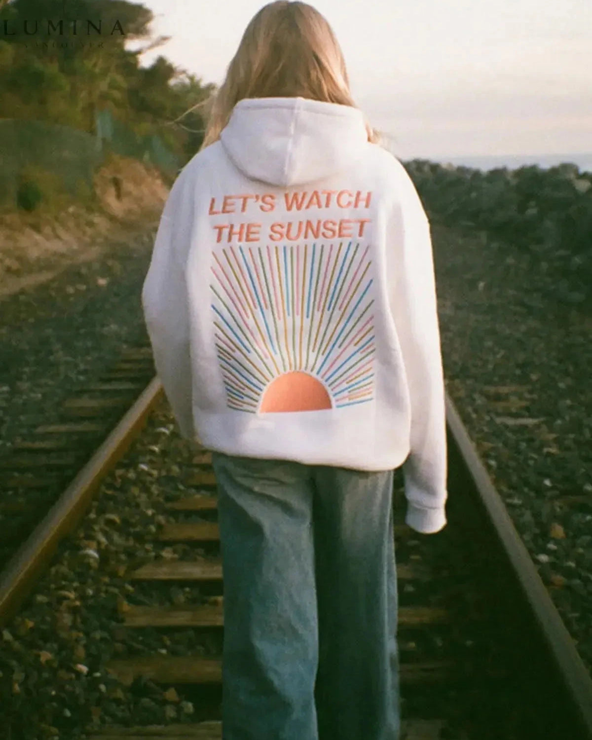 White Dalia Sunset Hoodie by Lumina Wear featuring a sunset design, soft fabric, and casual fit.