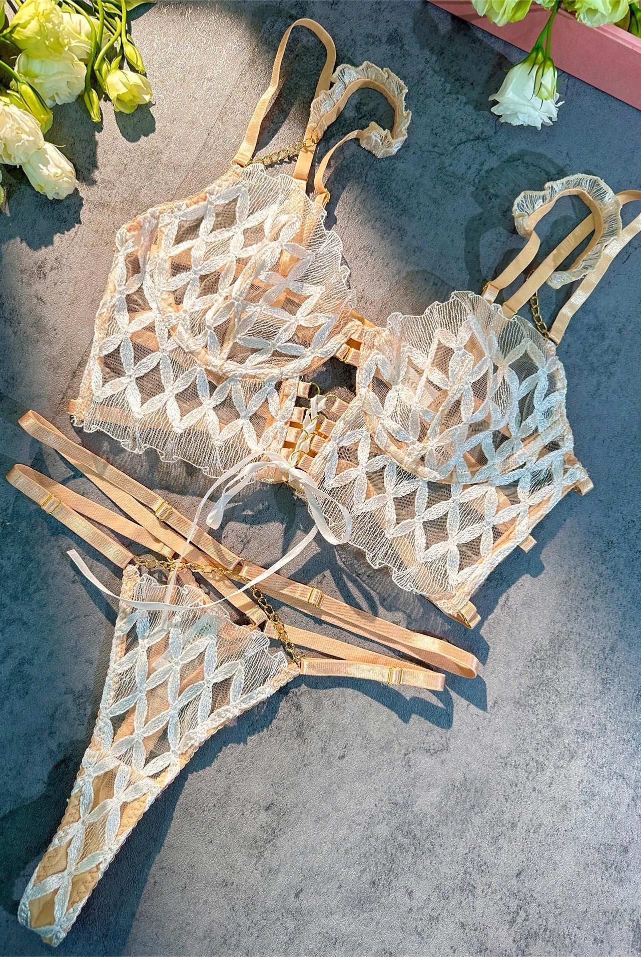 White embroidery lingerie set by Lumina Wear featuring delicate lace and feminine design, includes bra and matching panties.