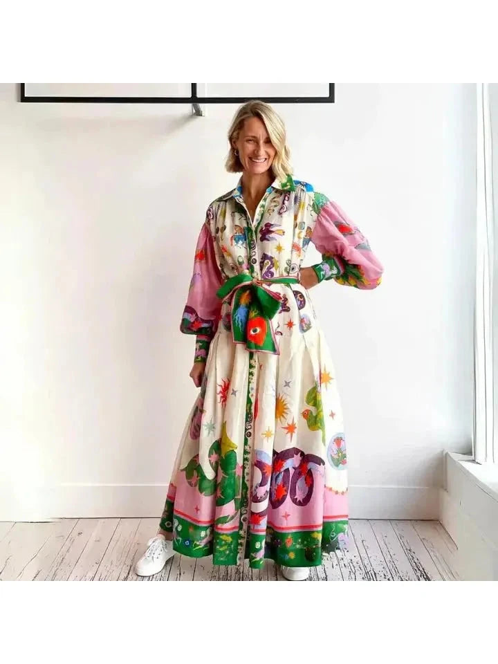 Delphina Italian maxi dress by Lumina Vancouver featuring flowing fabric and elegant design, worn by a model in a natural setting.