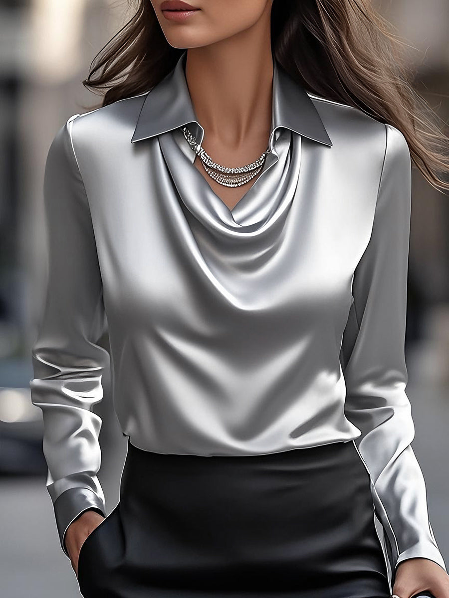 White satin Delphine blouse by Lumina Vancouver, featuring a draped design and elegant fit, shown on a model.