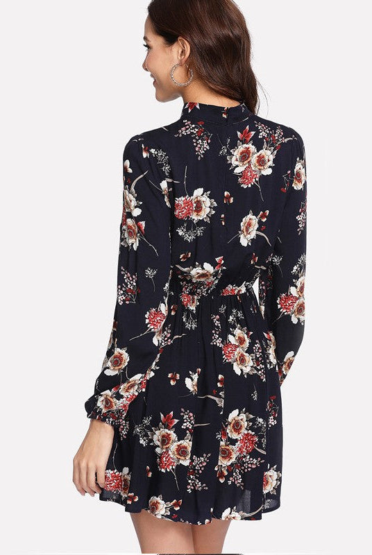 Dark blue Wenche Bloom Meadow floral mini dress by Lumina Wear, featuring a feminine, lightweight design and floral pattern.
