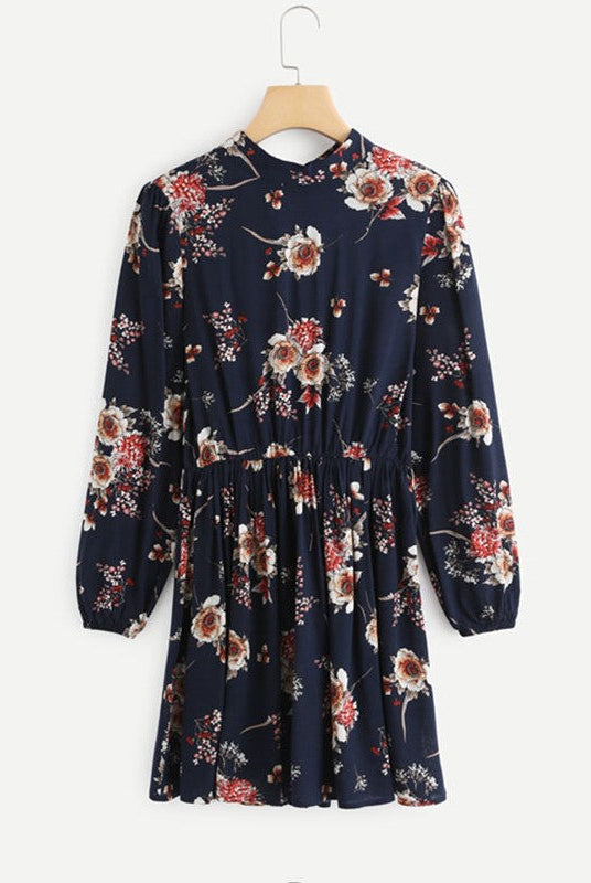 Wenche Bloom Meadow floral mini dress by Lumina Wear, dark blue with vibrant floral pattern, perfect for spring and summer wear.