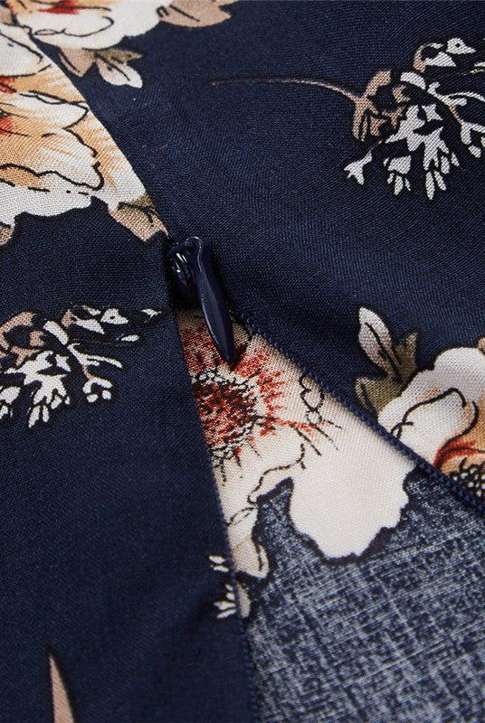 Dark blue Wenche Bloom Meadow floral mini dress by Lumina Wear featuring a feminine, flowy design perfect for warm weather.