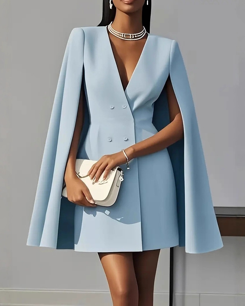Lumina Wear Elara double-breasted cape mini dress in apricot, featuring a stylish mini dress design with cape detail.