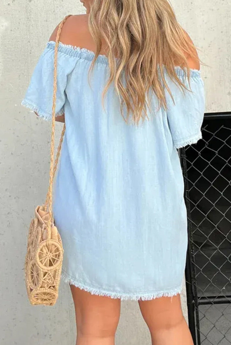 Black Elara off-shoulder denim mini dress by Lumina Vancouver, shown on a model with a fitted silhouette and casual style.