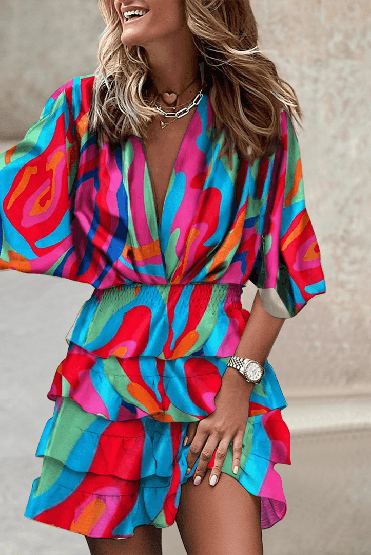 Blue Liv Romper V-Neck with smocked waist by Lumina Wear, featuring a mini dress design and sleeveless style.