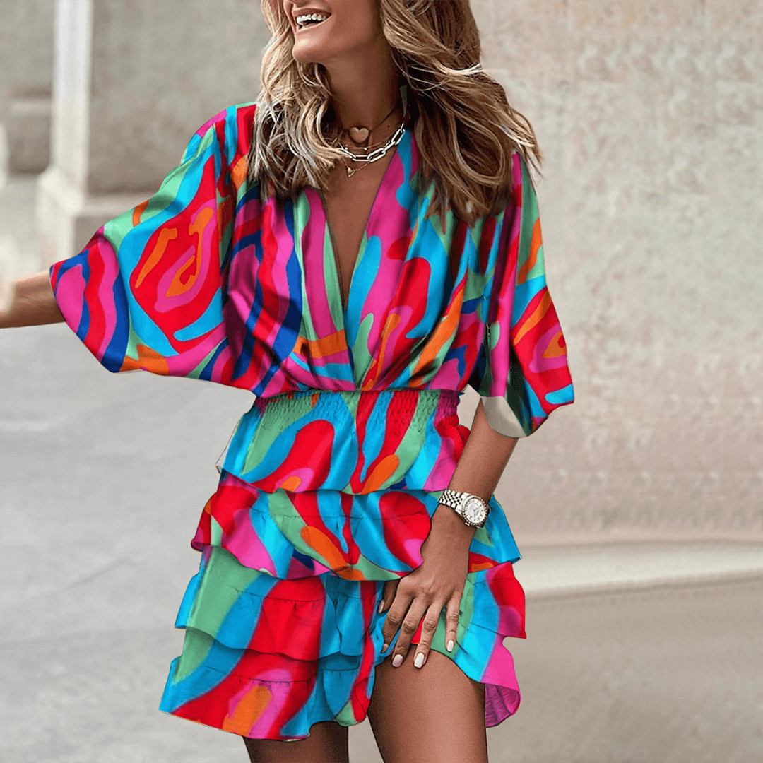 Blue Liv Romper V-Neck with smocked waist by Lumina Vancouver, styled as a mini dress, shown on a model.