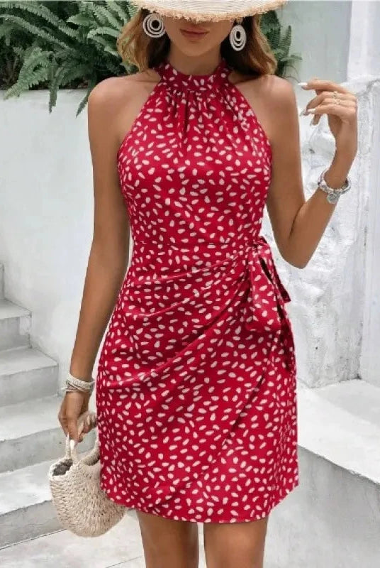Red Elara halter neck wrap mini dress by Lumina Vancouver, showcasing a fitted silhouette and stylish design.