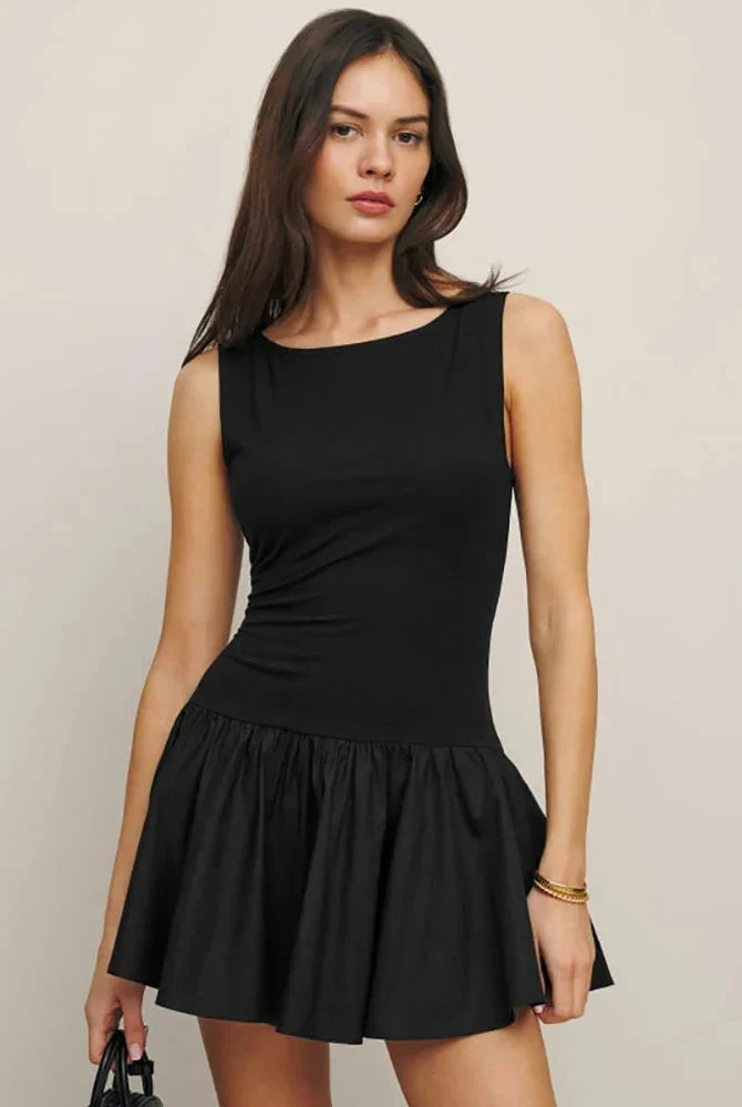 Black sleeveless A-line mini dress by Lumina Wear, featuring a fitted bodice and flared skirt, perfect for casual or semi-formal occasions.