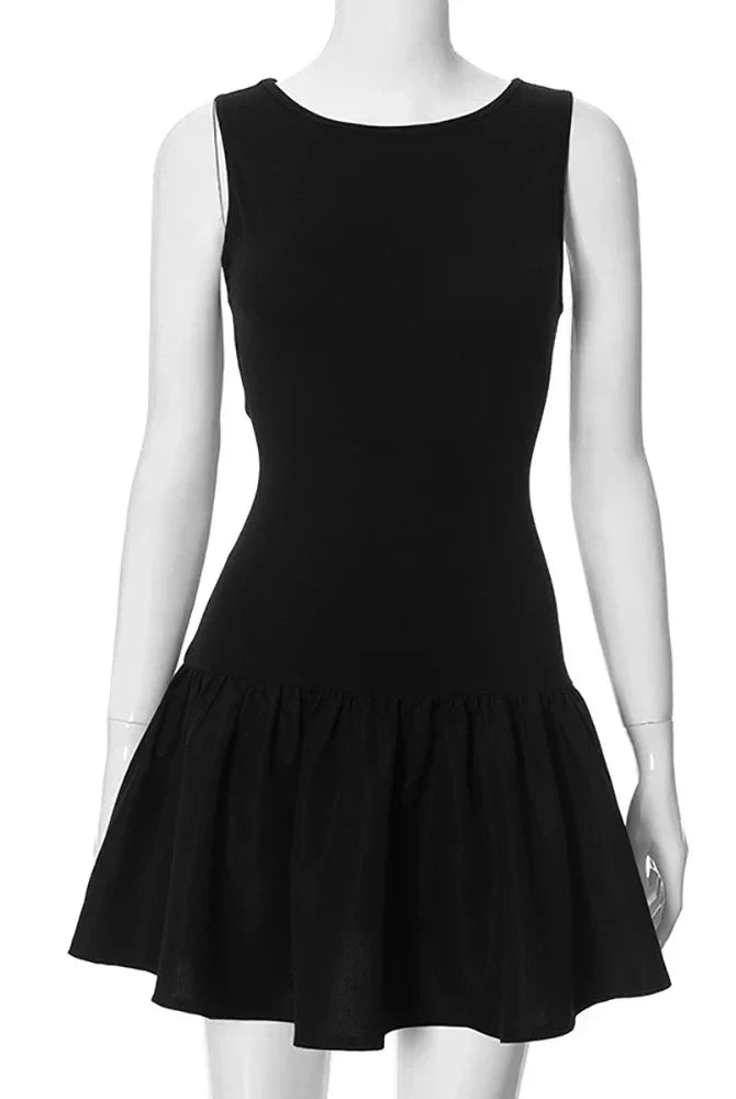 Black sleeveless A-line mini dress by Lumina Wear, featuring a fitted bodice and flared skirt, perfect for casual or dressy occasions.