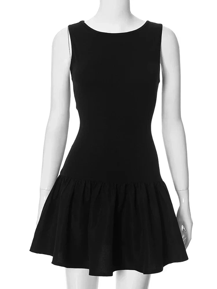 Black sleeveless A-line mini dress by Lumina Vancouver, featuring a fitted bodice and flared skirt, perfect for casual or elegant wear.