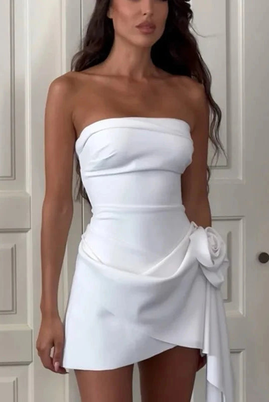 Lumina Wear Randi strapless satin mini dress in white, shown on a model, highlighting its sleek strapless design and smooth satin fabric.