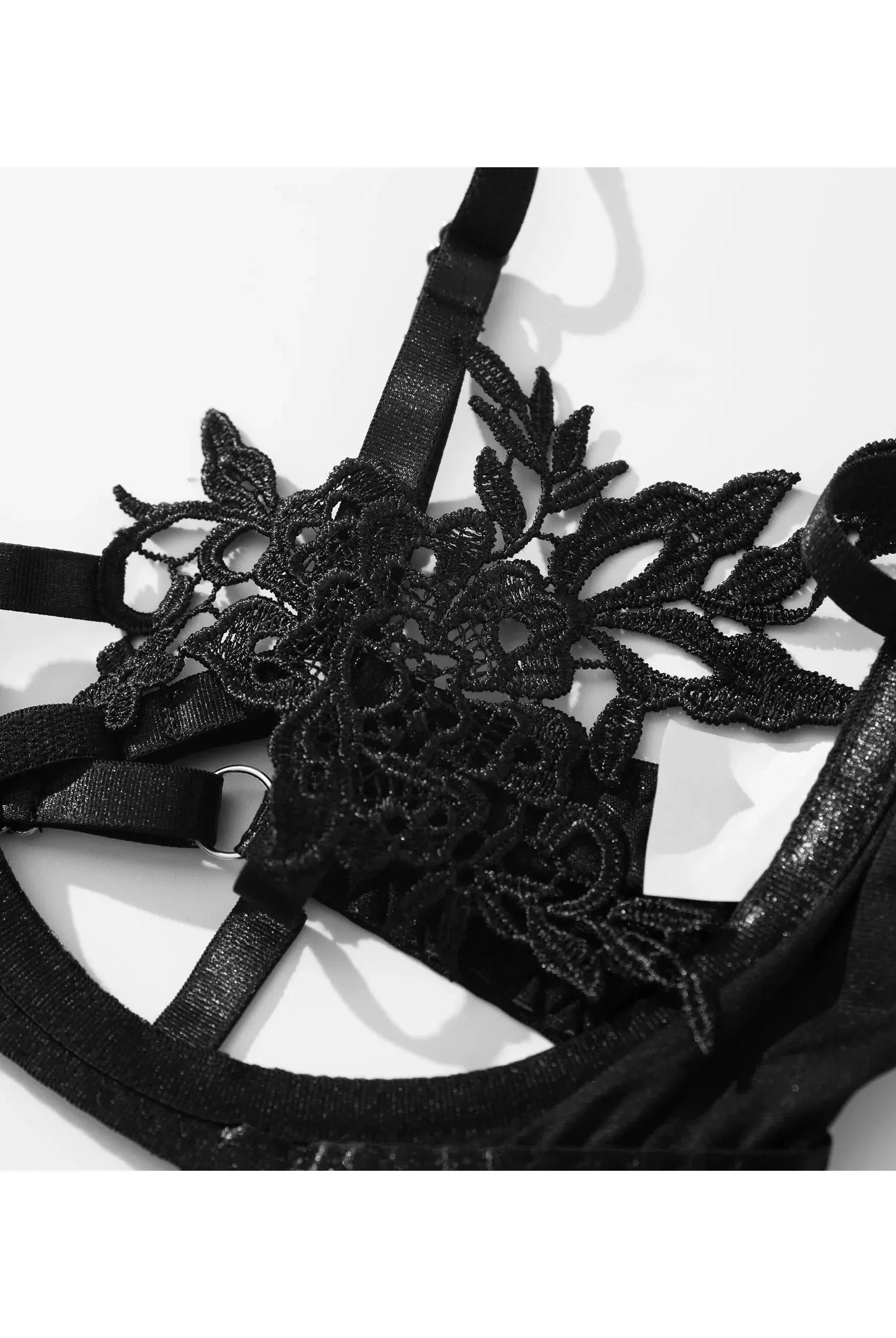 Black Elena 3-piece French lingerie set by Lumina Vancouver with lace and satin details, featuring a bra, panties, and garter belt.