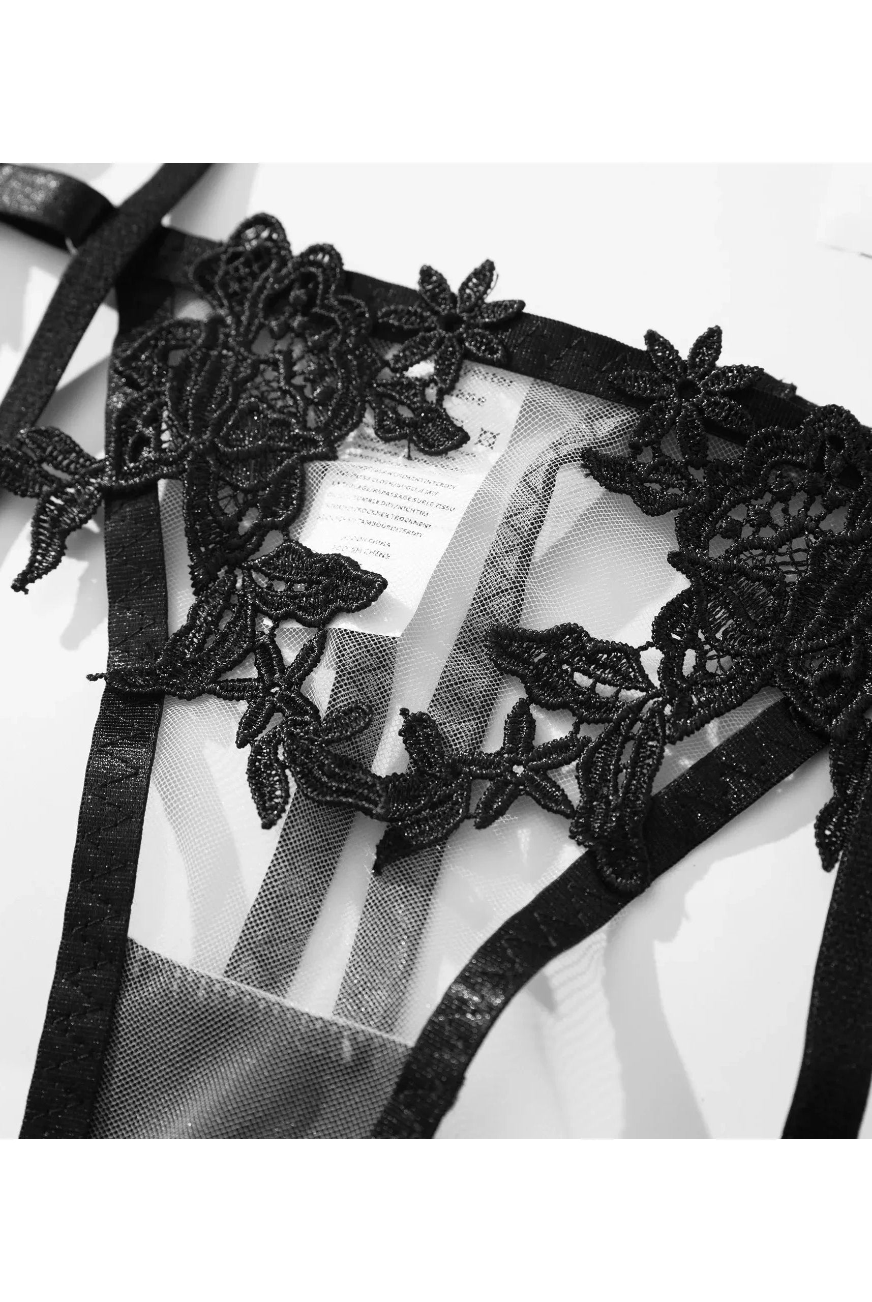 Black Elena 3-piece French lingerie set by Lumina Vancouver, featuring delicate lace and elegant design, shown on a model.