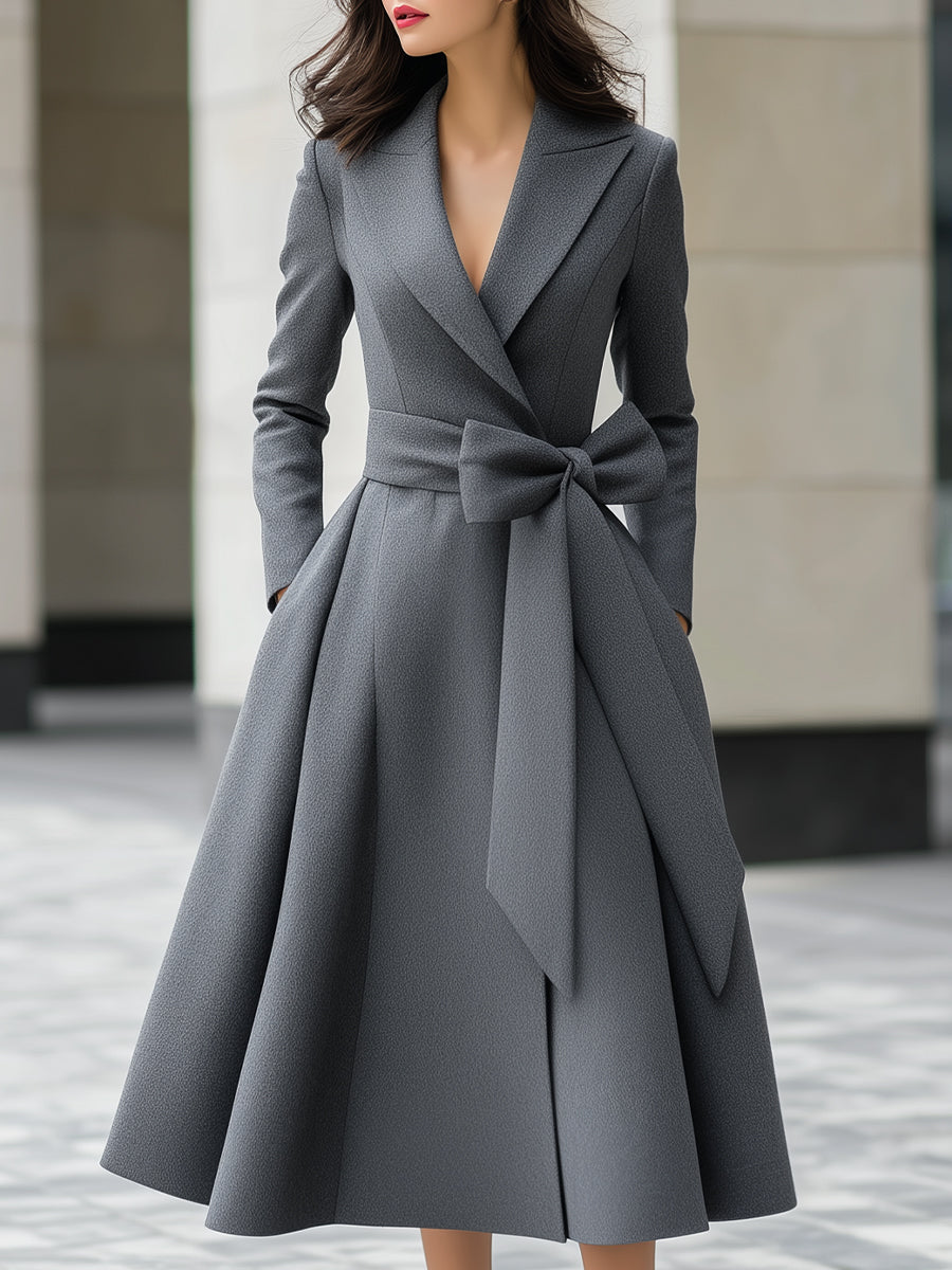 Yvette Lumina grey A-line coat dress with bow belt detail, stylish outerwear for elegant winter or fall wear.