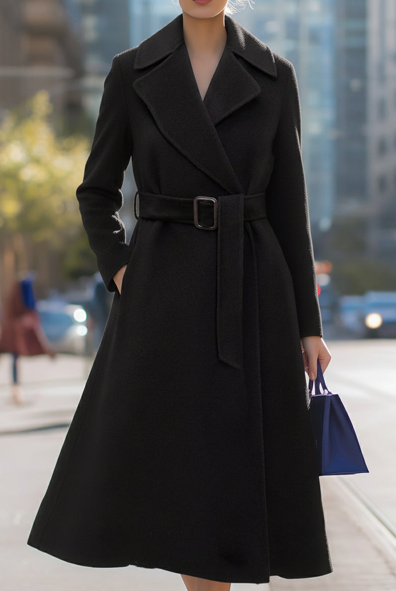 Black Lumina Vancouver Edith wool-blend midi coat with belted lapel collar, shown on a model in a natural pose.