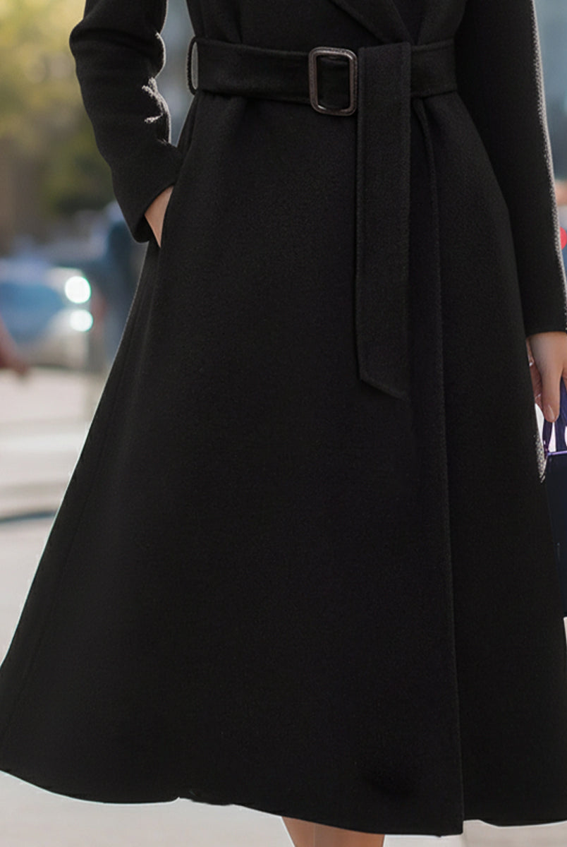 Black Lumina Vancouver Edith wool-blend midi coat with belted lapel collar, shown on a model in a close-up view.