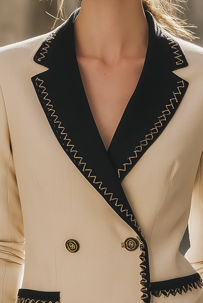 Beige Elodia blazer with black contrast trim from Lumina Wear, featuring tailored fit and stylish lapel details.