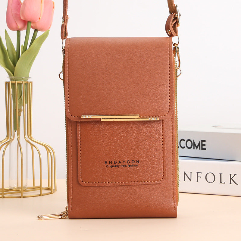 Black Elena Lumina Wear touchscreen messenger bag for women, stylish handbag with modern design and functional features.