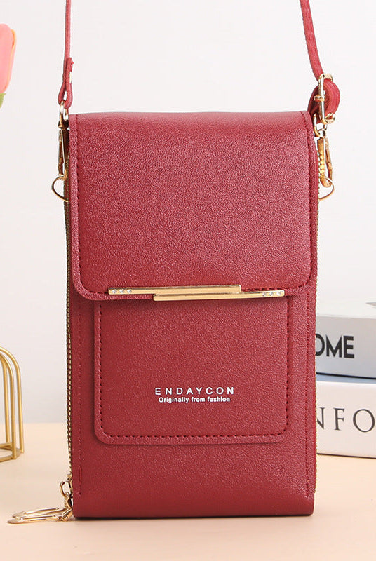 Black Lumina Wear Elena touchscreen messenger bag for women, featuring sleek design and modern style.