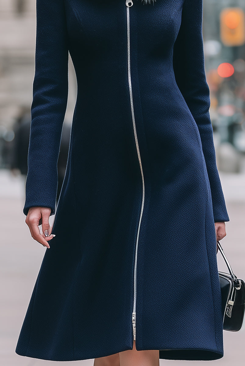 Navy blue Cecile coat with faux fur collar by Lumina Vancouver, shown on a model, featuring a stylish, cozy winter outerwear design.