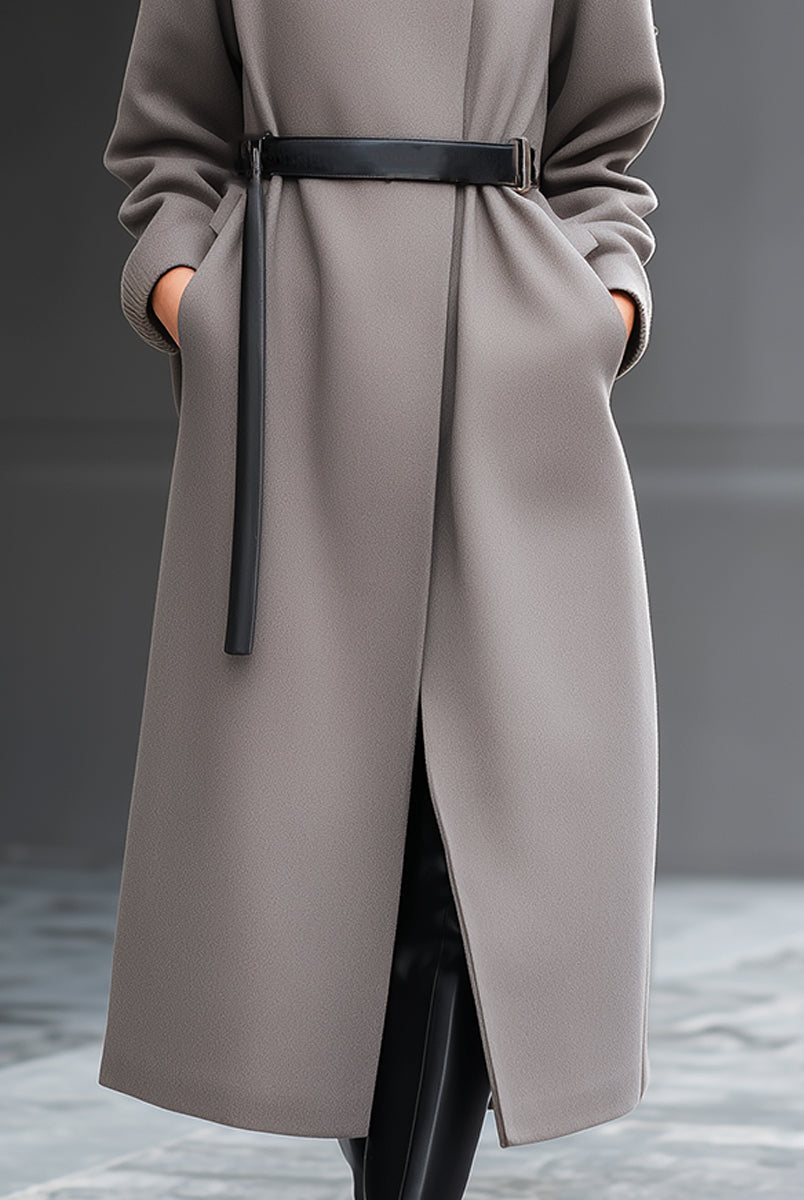 Taupe Wilhelmina coat by Lumina Vancouver featuring a minimalist belted design, shown on a model with long sleeves and a sleek silhouette.