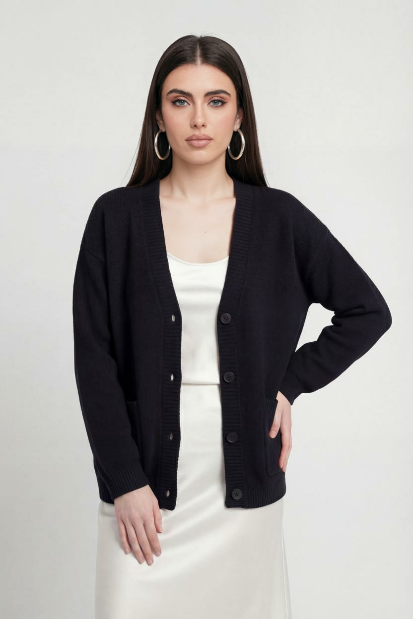 Black knit cardigan with ribbed details from Lumina Wear, featuring a cozy fit and classic design, perfect for layered looks.